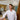 Man in a white shirt standing in a modern interior setting